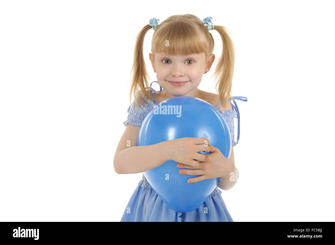Little girl with colour balls Stock Photo
