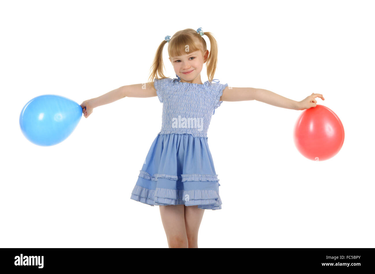 Little girl with colour balls Stock Photo