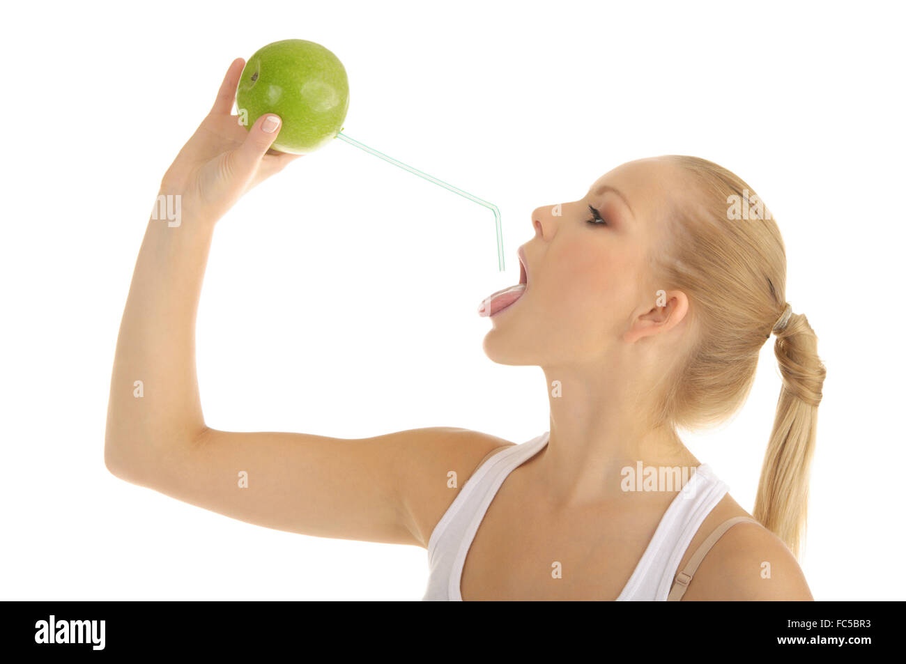 young woman drinking juice from an apple Stock Photo