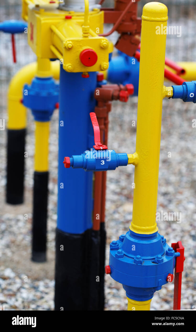 Yellow gas pipe with a crane and valve Stock Photo Alamy