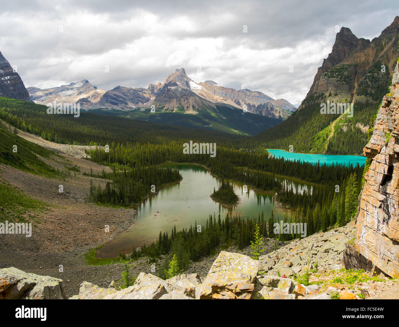 High angle view of Mary Lake (foreground), Lake O'Hara (right), Cathedral Peak (background) and Wiwaxy Peak (right) Stock Photo