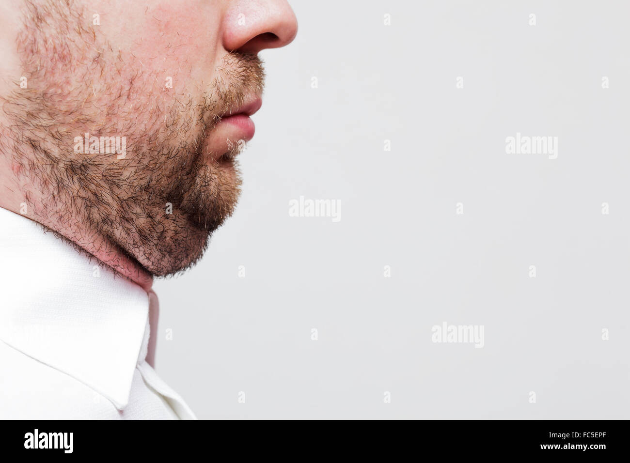 young man with a double chin - the result of poor lifestyle Stock Photo