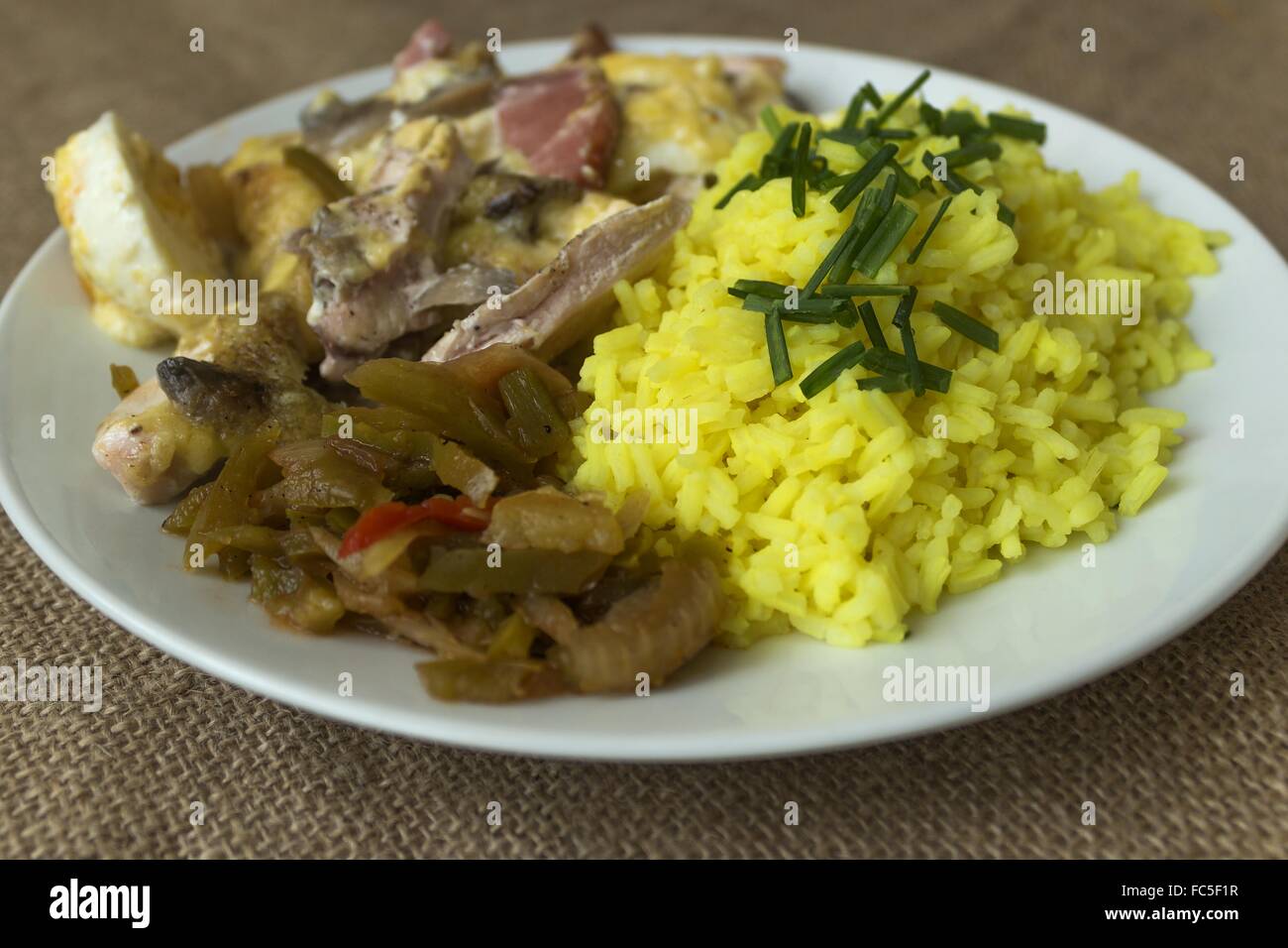 picture taken January 16, 2016 Jablonec nad Nisou, Czech Republic baked chicken with rice and pickles on a white plate light bac Stock Photo