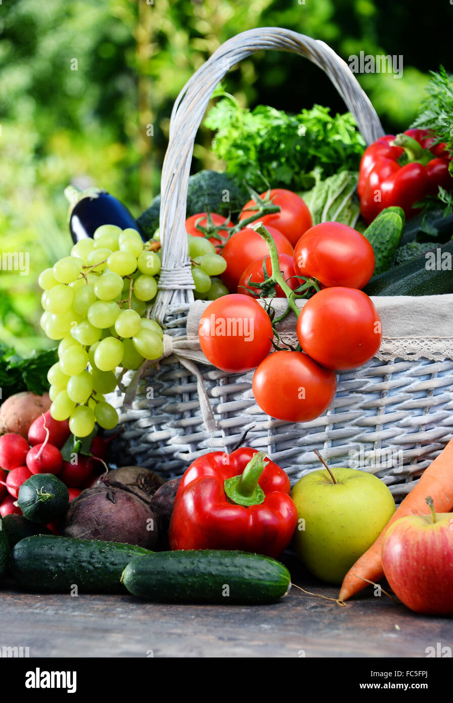 Variety of fresh organic vegetables and fruits in the garden. Balanced ...