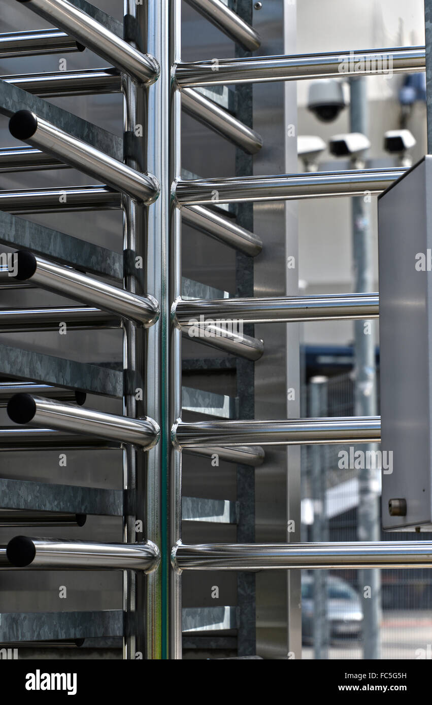 Fullheight turnstile guarded stadium entrance. Revolving door Stock