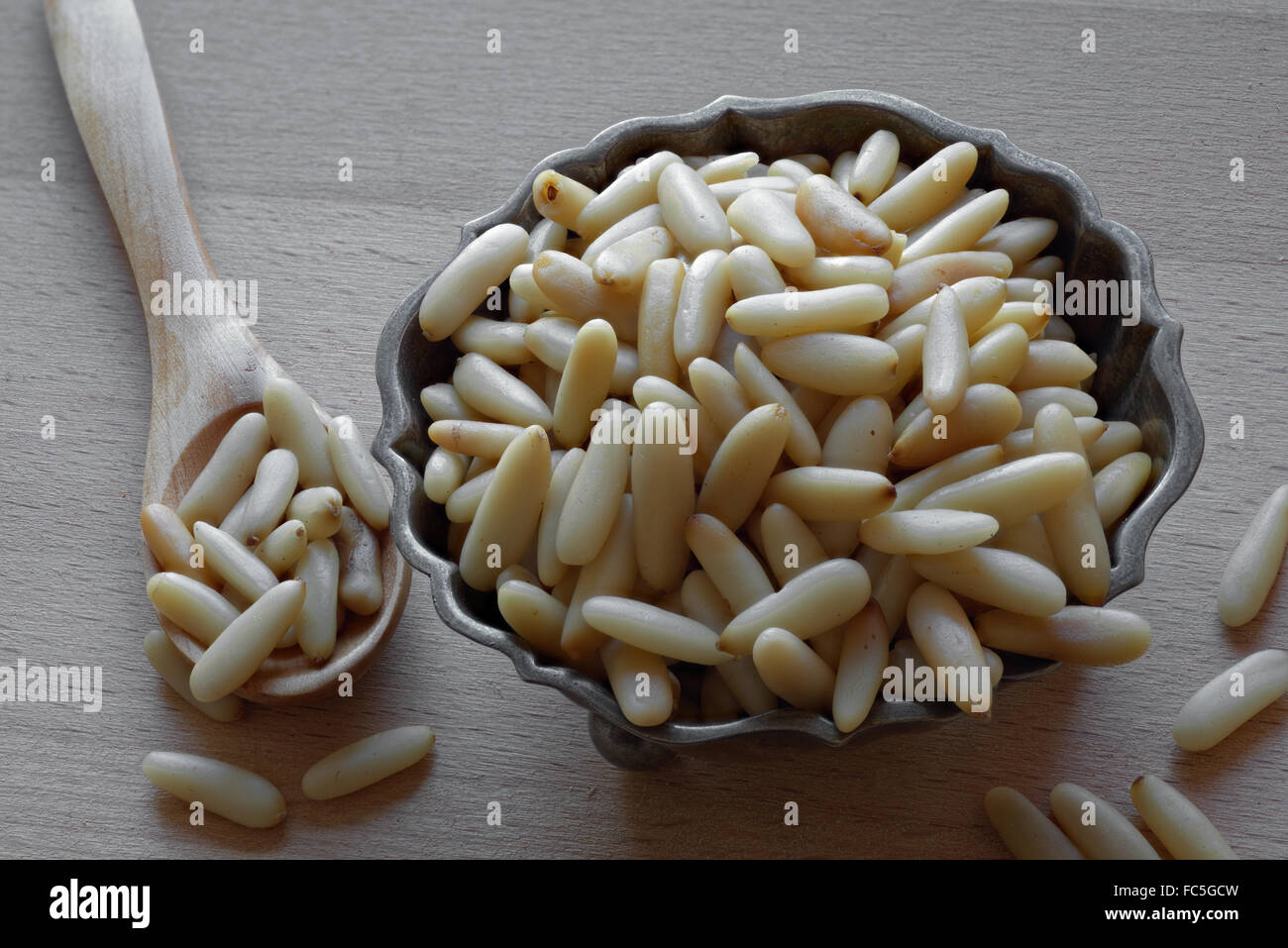 Pine Kernels in a Silver bowl Stock Photo - Alamy