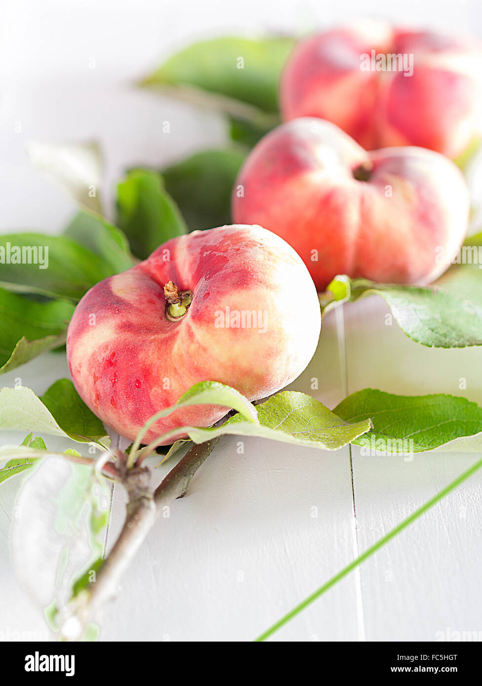 Peaches on sheets Stock Photo Alamy