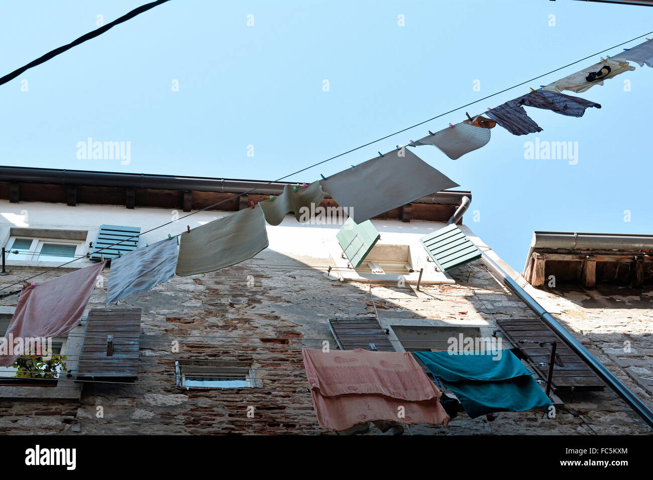 clothesline on an old house in Croatia Stock Photo