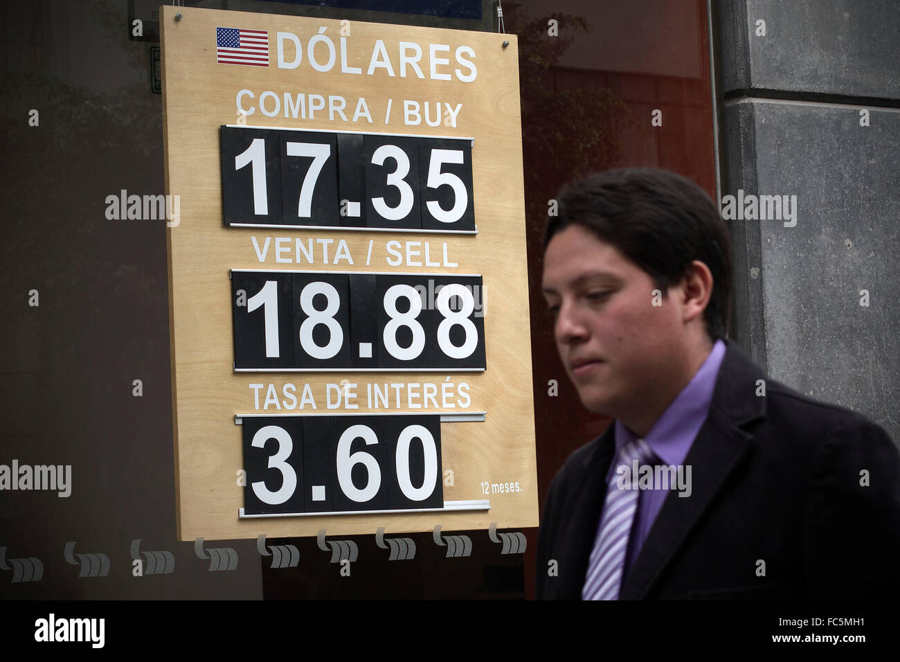 Mexico City, Mexico. 20th Jan, 2016. A man walks past a board showing the exchange rate of Mexican peso to the U.S. dollar, in Mexico City, capital of Mexico, Jan. 20, 2016. According to the Bank of Mexico (Banxico), Mexican peso depreciated 2.3 percent against the U.S. dollar. © Alejandro Ayala/Xinhua/Alamy Live News Stock Photo
