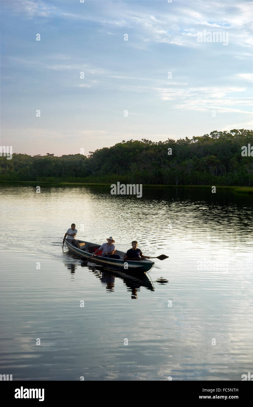 Canoe in the Amazon River in Ecuador Stock Photo