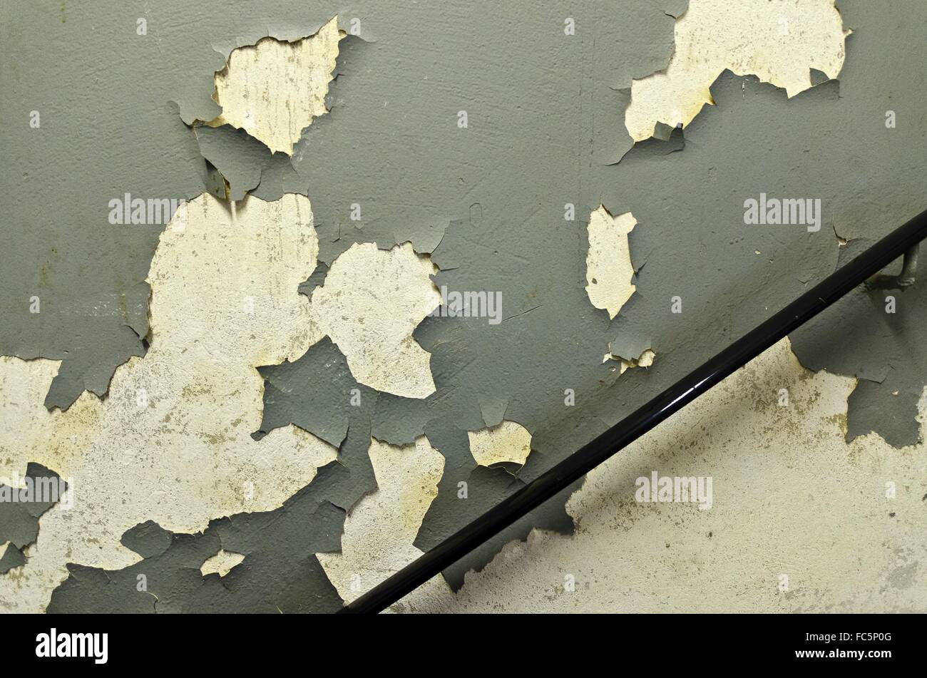 wall with olive peeling paint Stock Photo