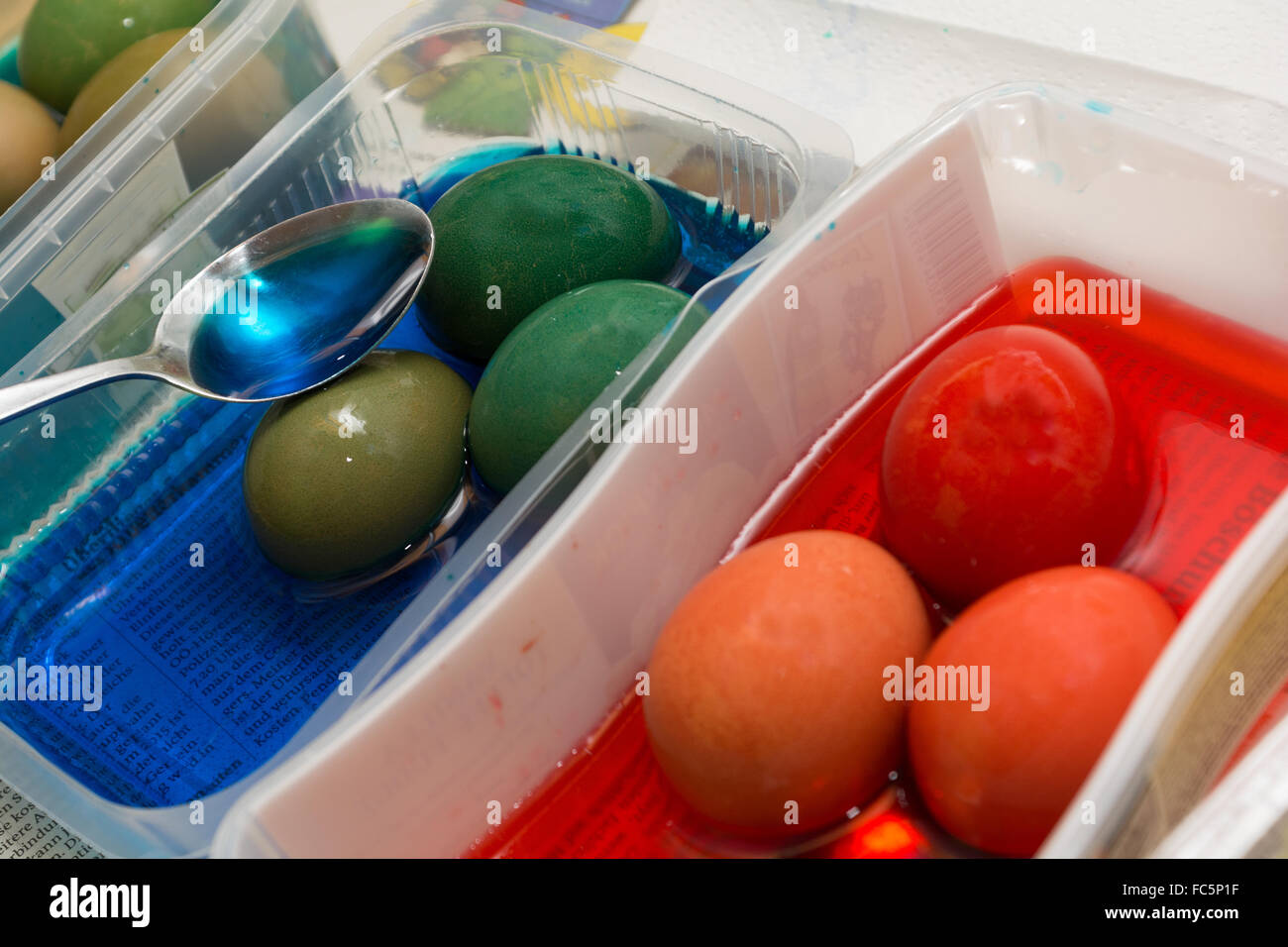 Person in the dyeing of Easter eggs Stock Photo
