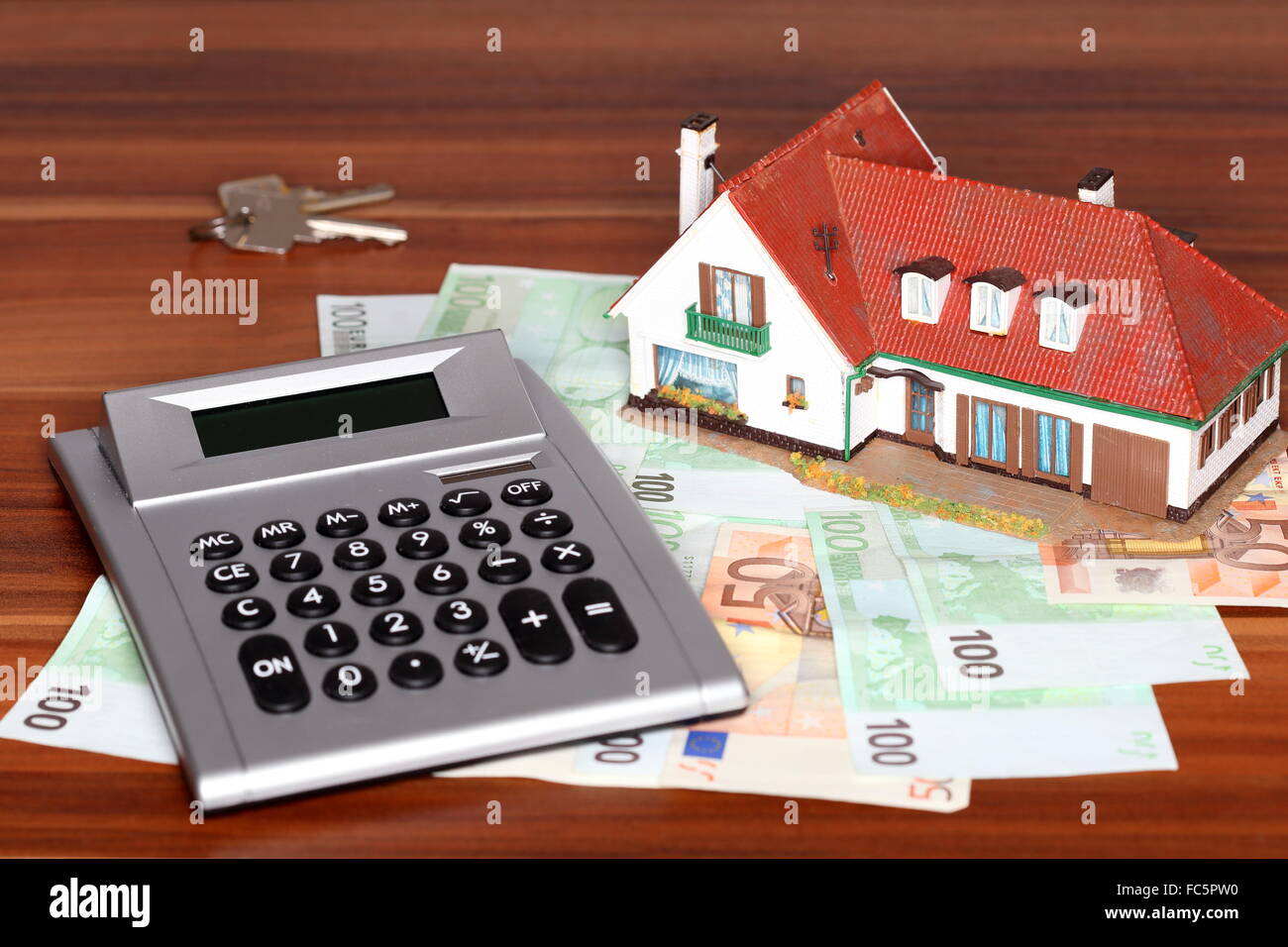 key calculator and house model Stock Photo