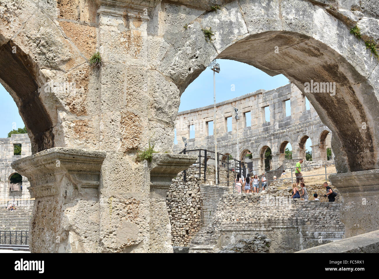 Tourists in the Arena of Pula Stock Photo