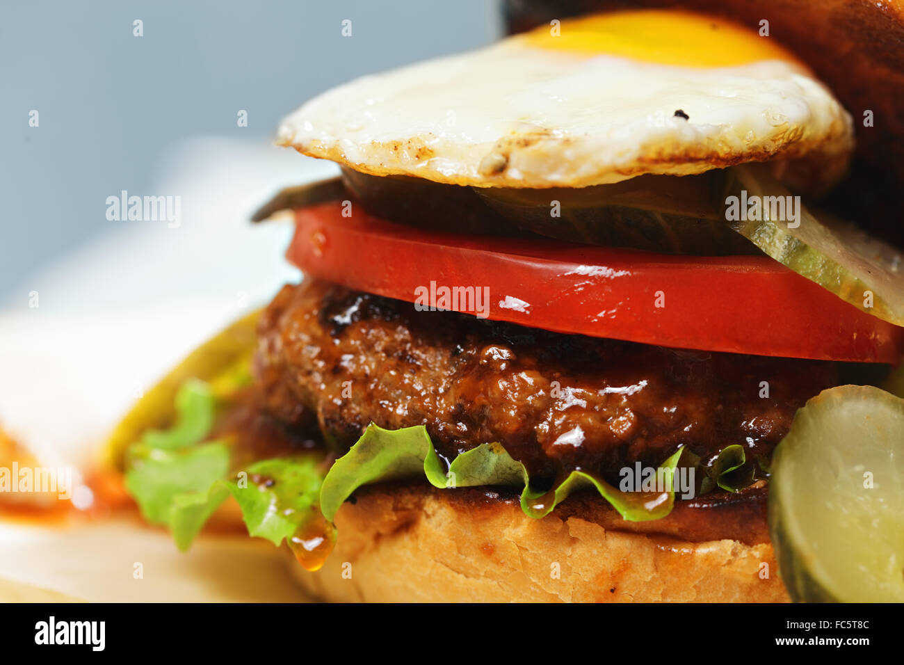 Sunny side up burger closeup Stock Photo Alamy