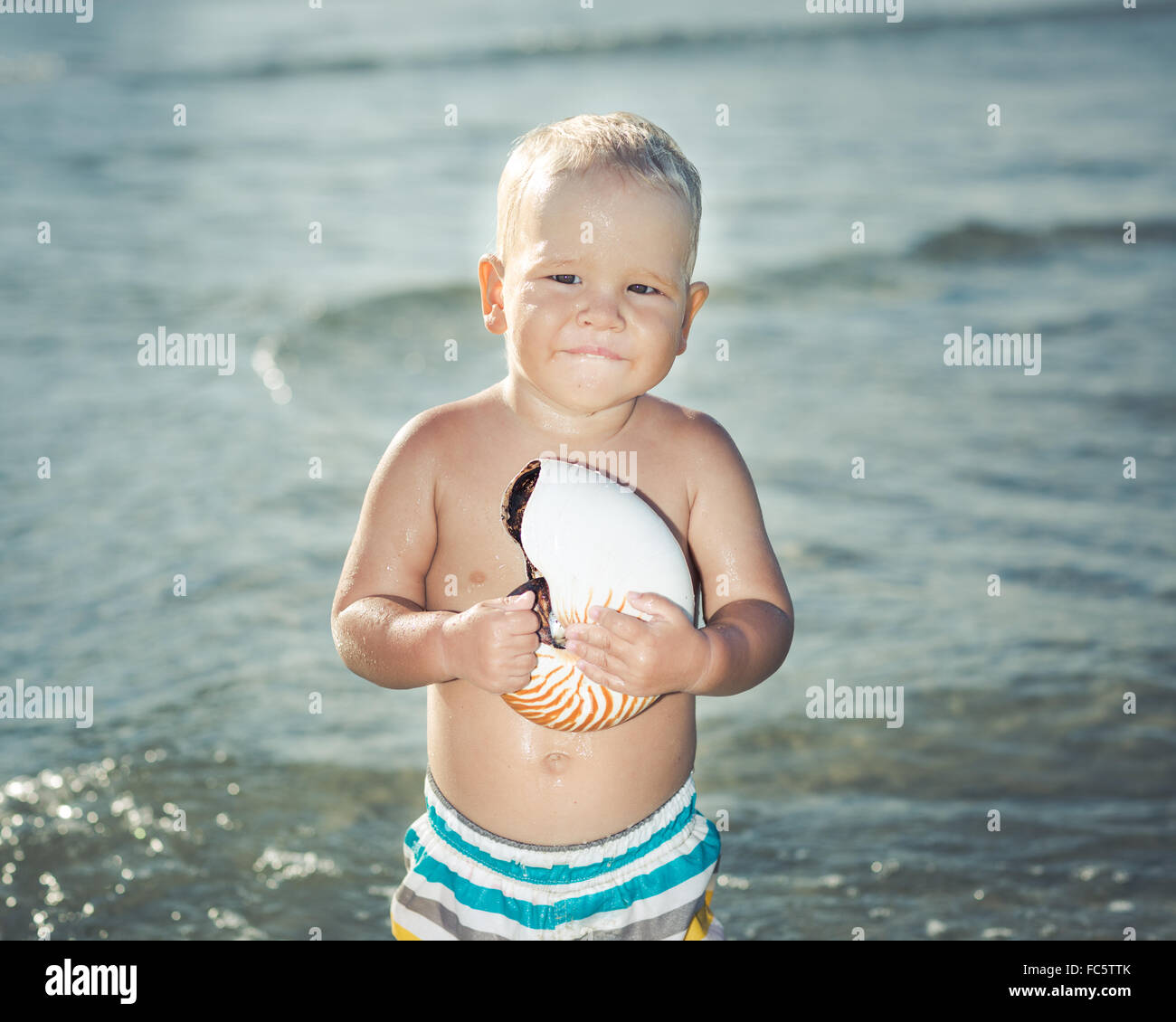Baby in a sea Stock Photo