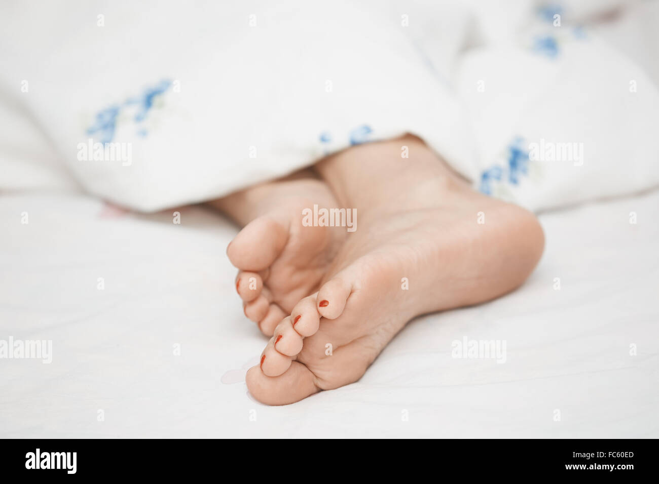Feet of sleeping woman Stock Photo Alamy