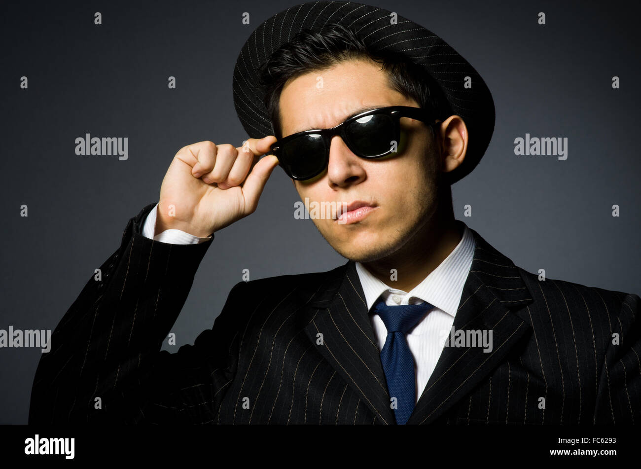 Young gangster in suit hat hi-res stock photography and images - Alamy