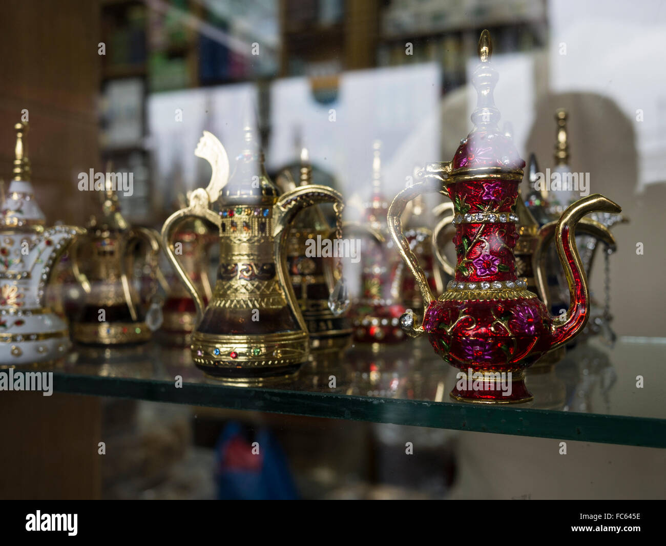 Top angle view of ornamental Arabian tea pots on display in Dubai Souk