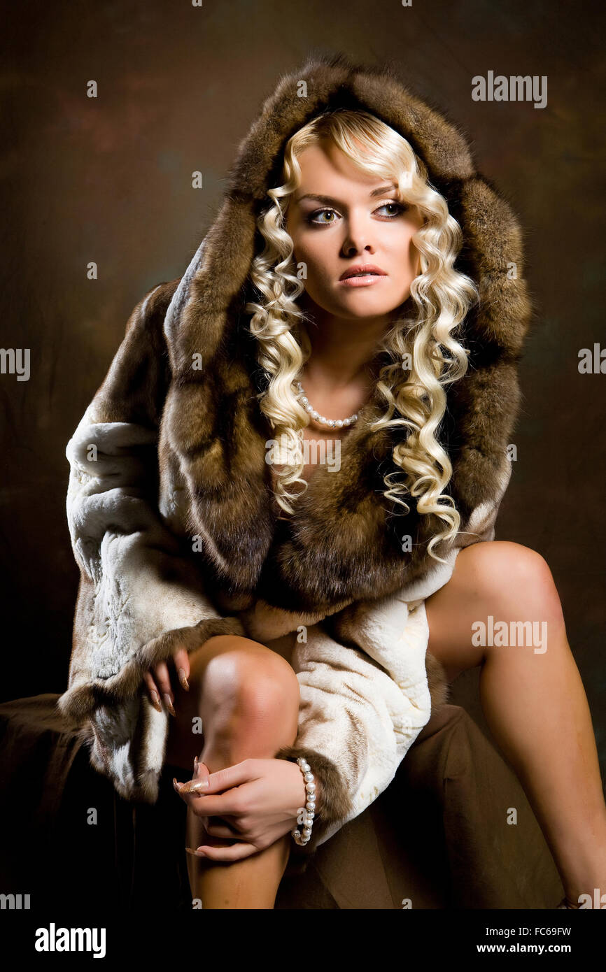 Young Woman In Fur Coat Stock Photo