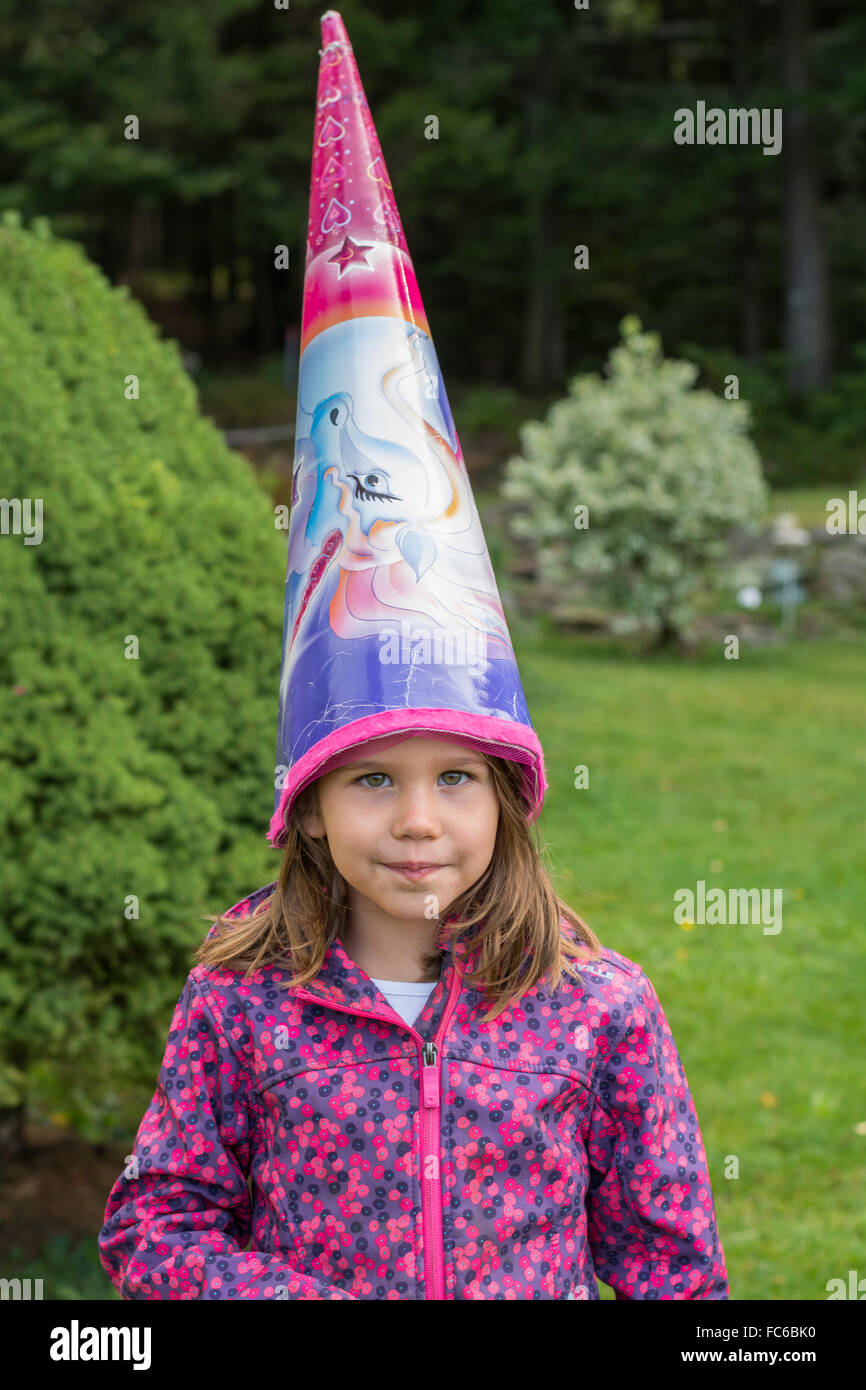 schoolchild with treats on head Stock Photo
