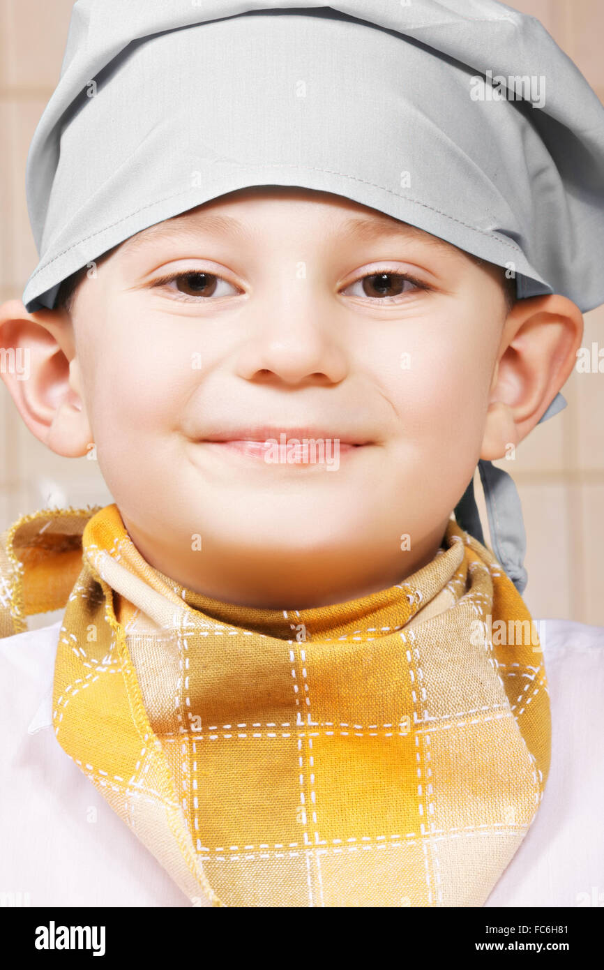 Portrait of smiling little cook Stock Photo