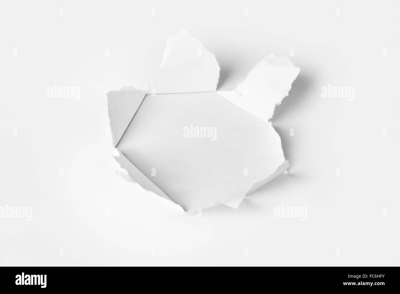 Circle shape hole punch on white background Stock Photo - Alamy