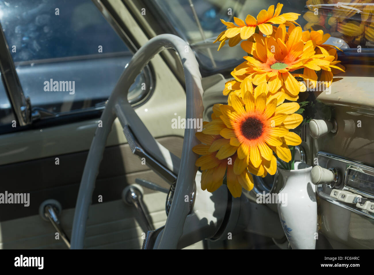 Oldtimer with flowers at the steering wheel Stock Photo