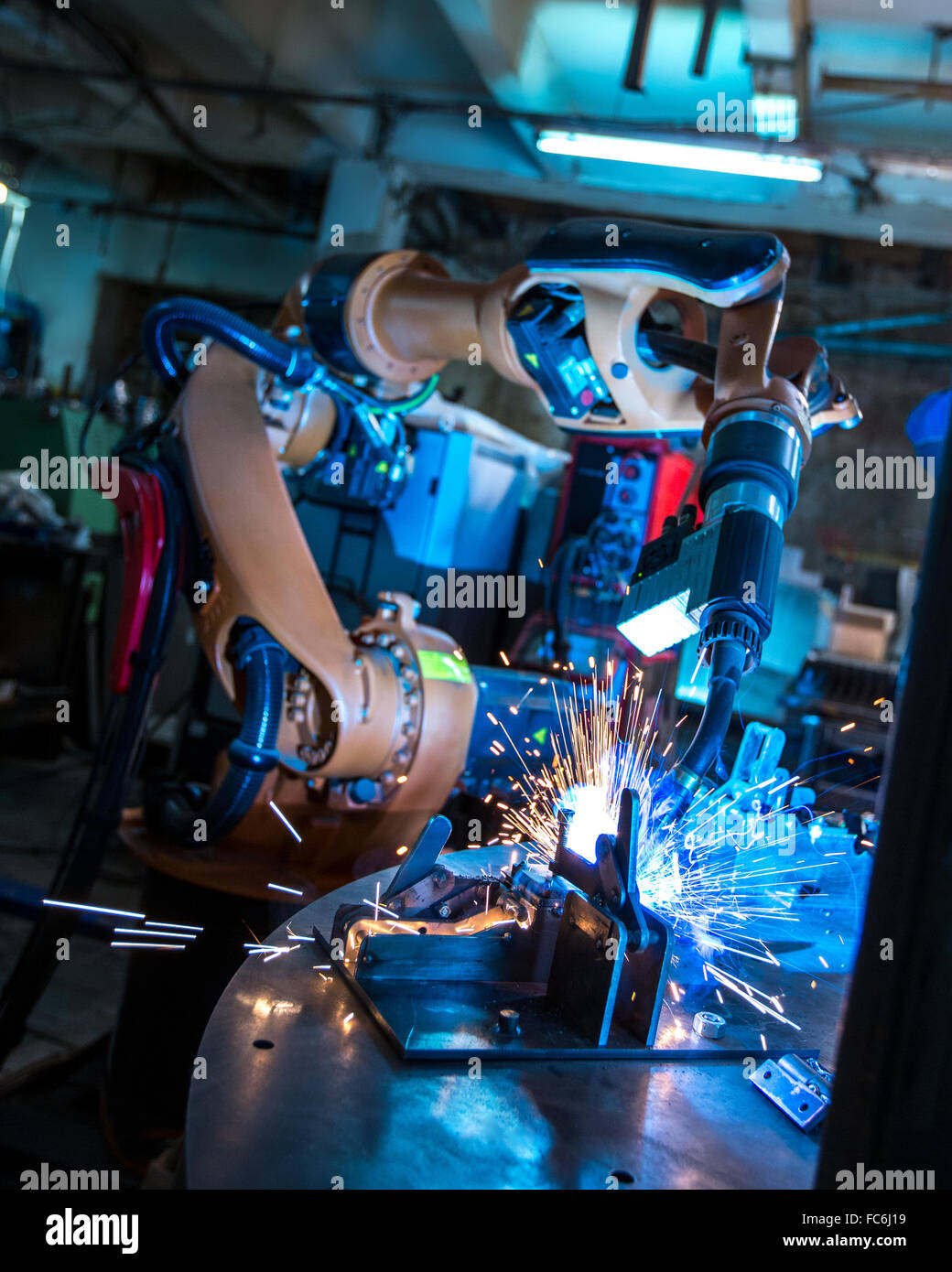 Manufacturing. Robotic machine welding metal Stock Photo
