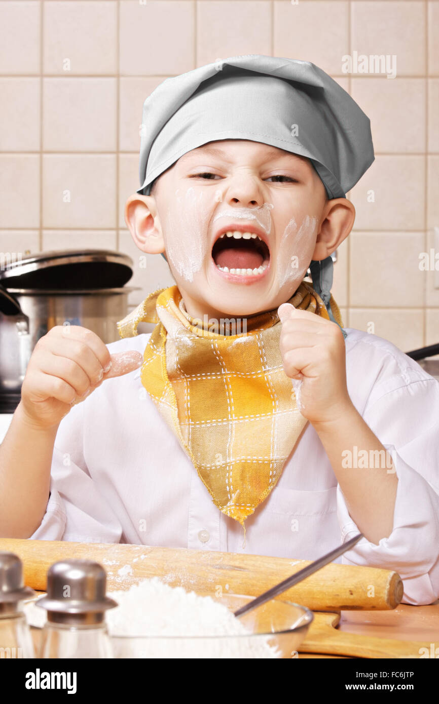 Shouting little cook Stock Photo