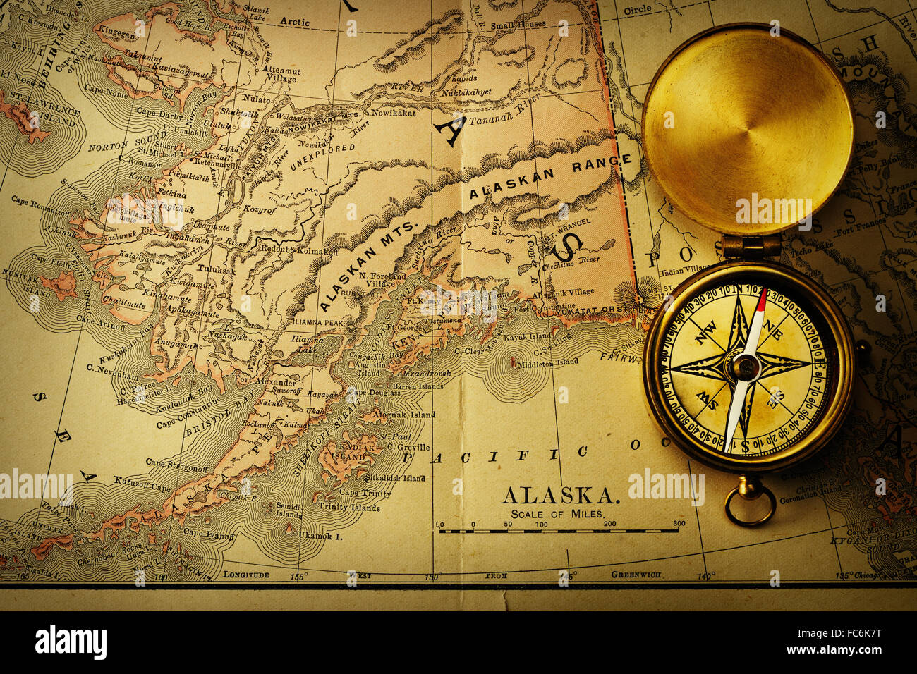 Antique compass over old XIX century map Stock Photo