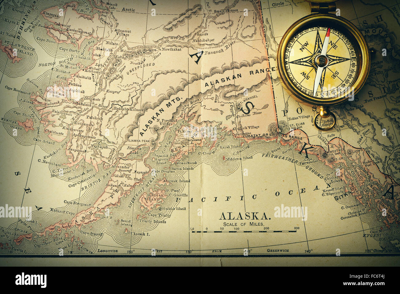 Antique compass over old XIX century map Stock Photo