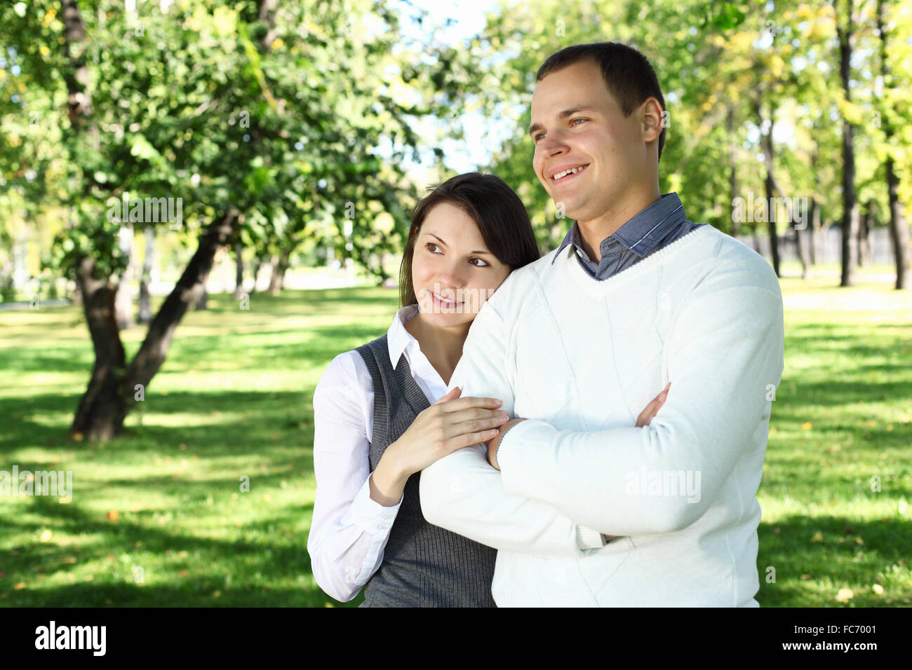 Young family with a child in green summer park Stock Photo - Alamy