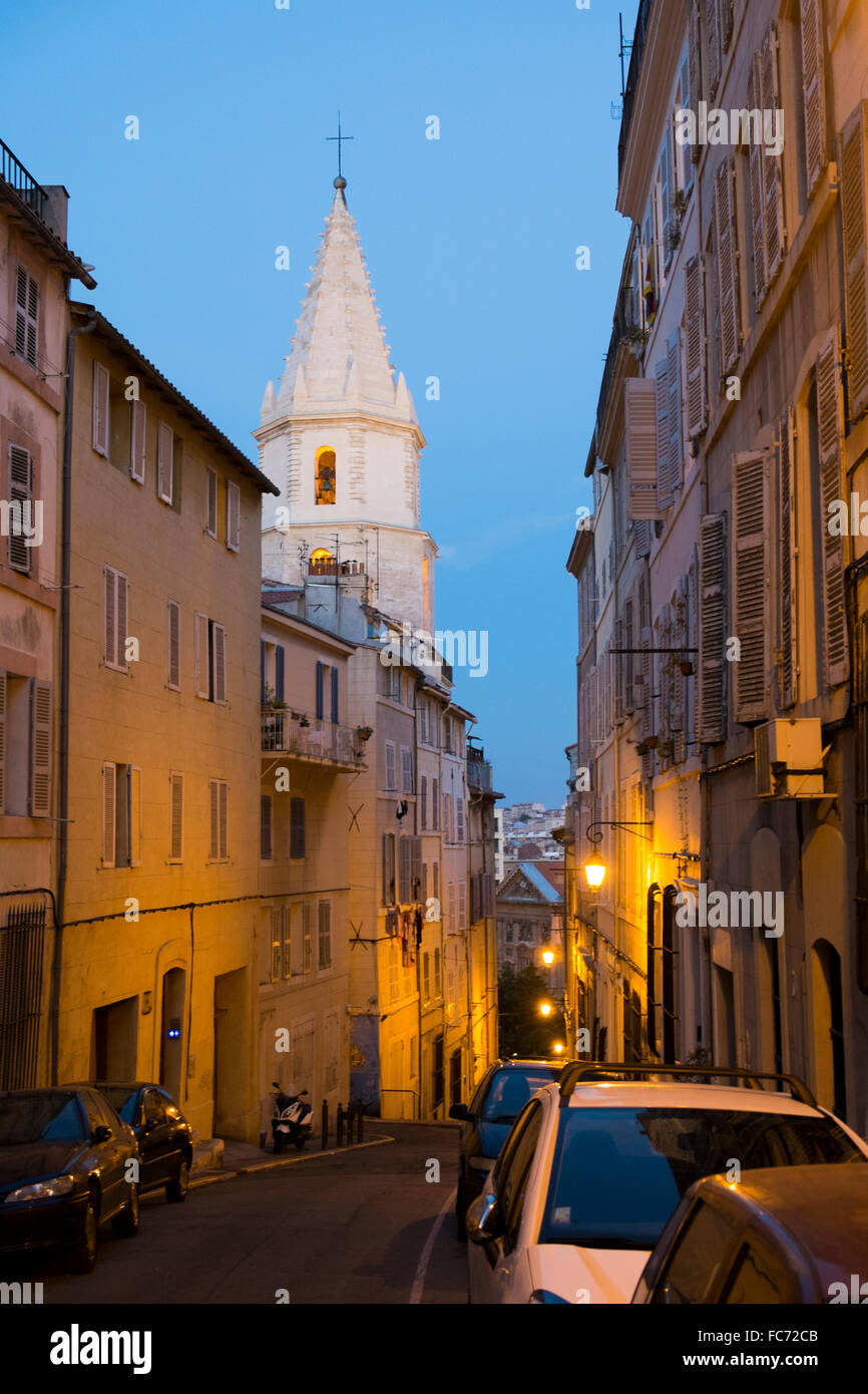 A narrow street and church at twilight in the Panier neighborhood of Marseille, France. Stock Photo