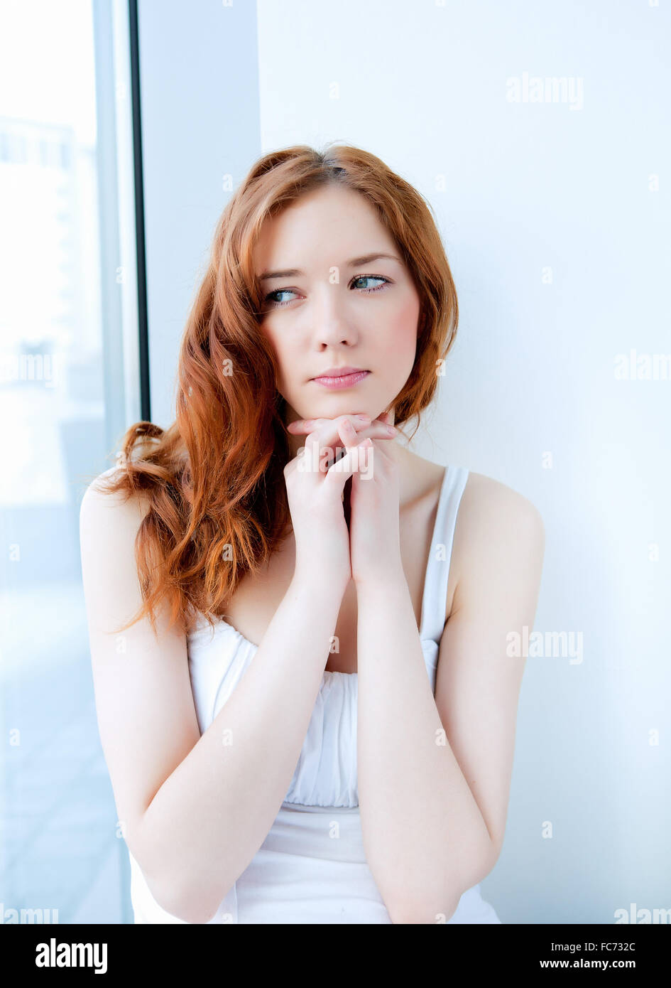 portrait of a young pretty woman at home Stock Photo - Alamy