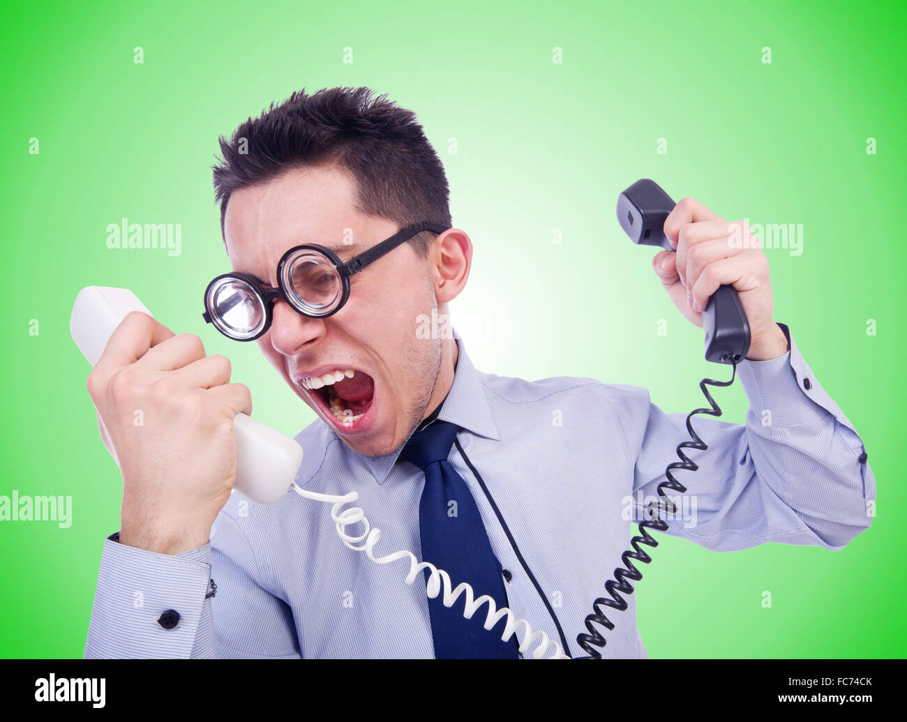 Crazy man with phone on white Stock Photo - Alamy