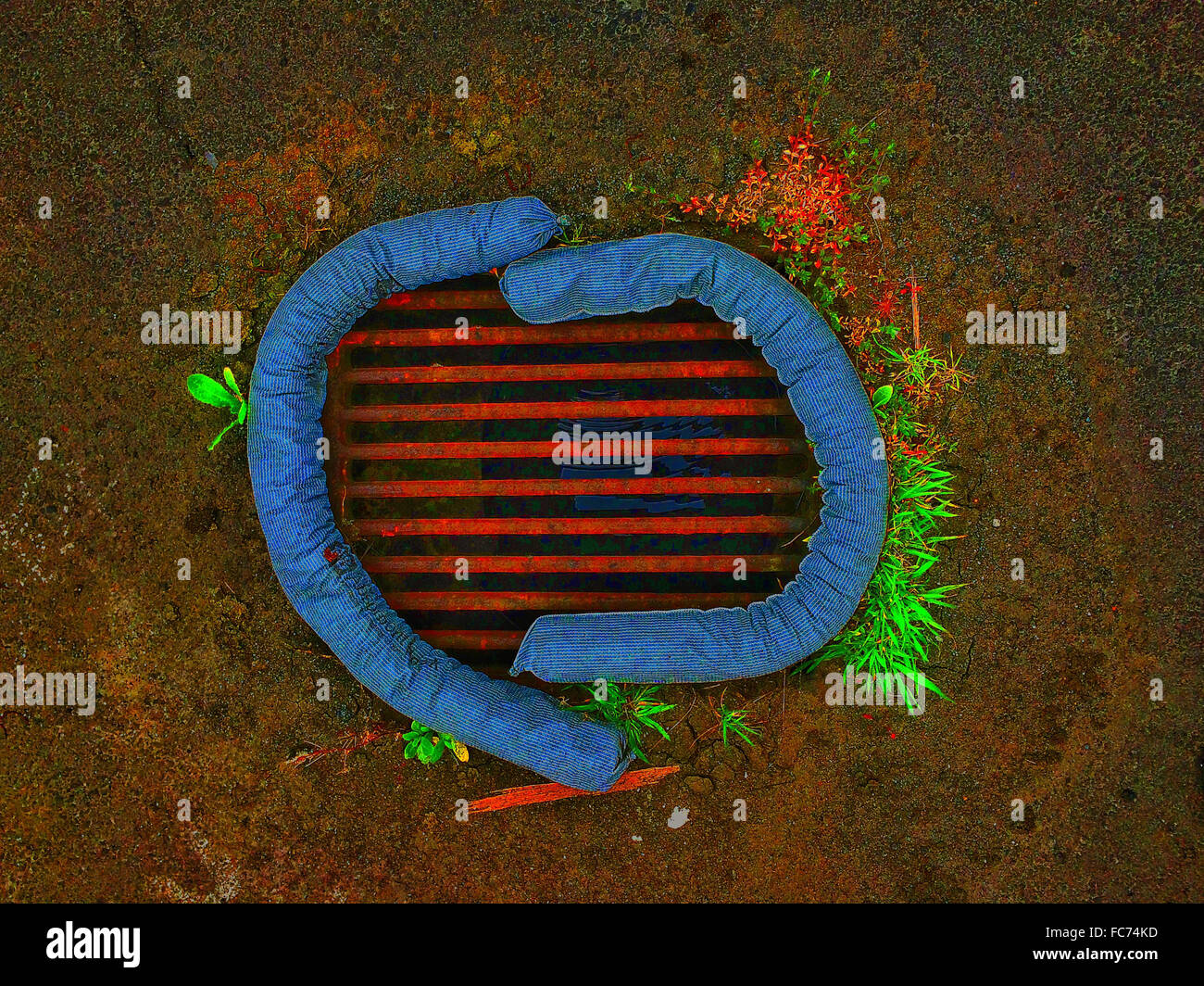 Sandbags wrapped around storm drain - Smartphone Captured Stock Image