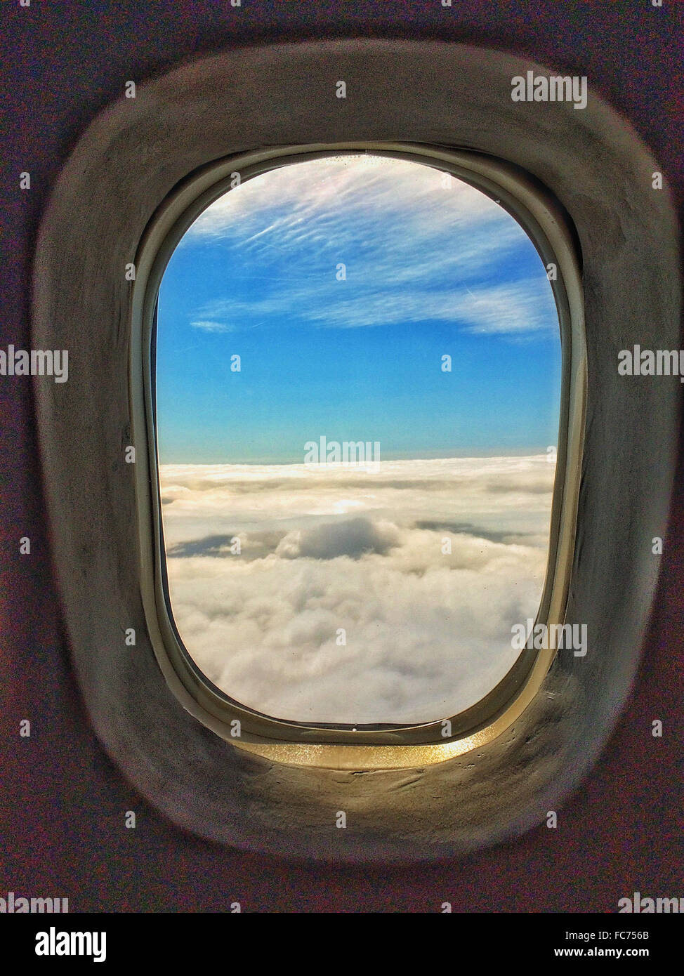 Clouds and sky through airplane window - Smartphone Captured Stock Image