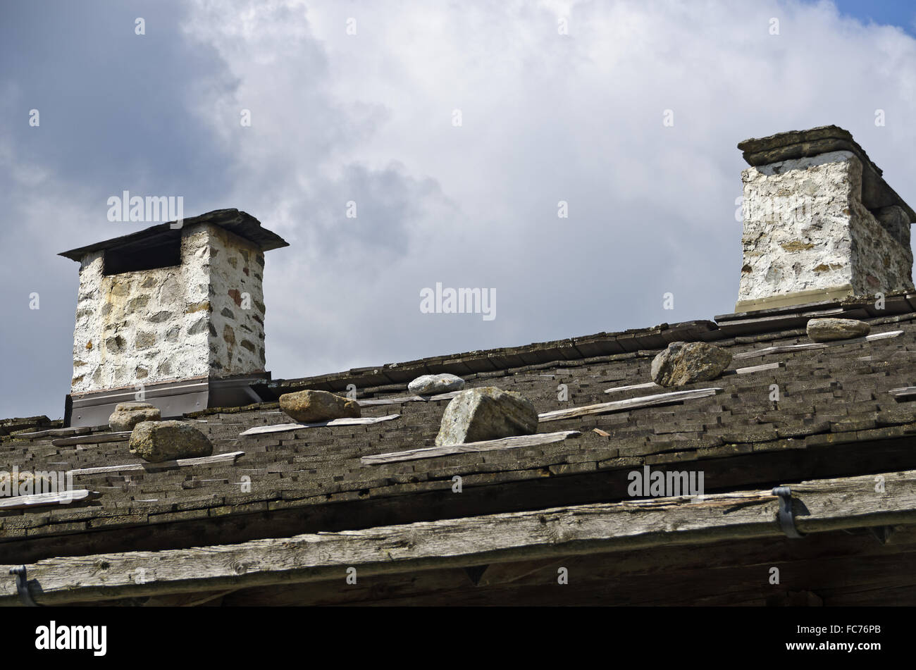 brick-built chimneys on a roof Stock Photo