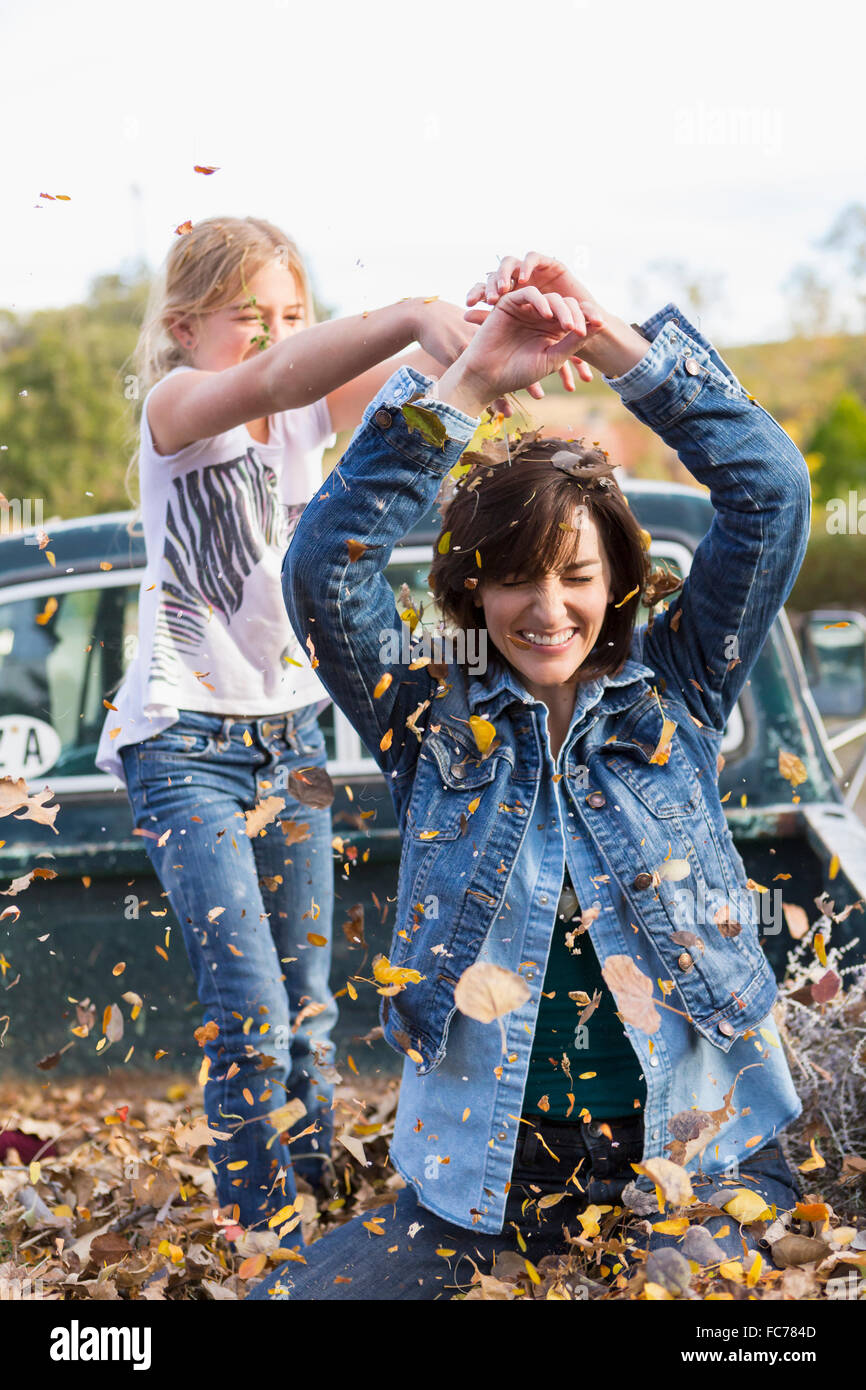 Mother and daughter playing in truck bed Stock Photo