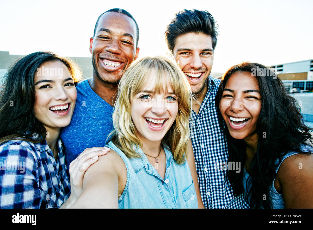 Friends posing for selfie outdoors Stock Photo