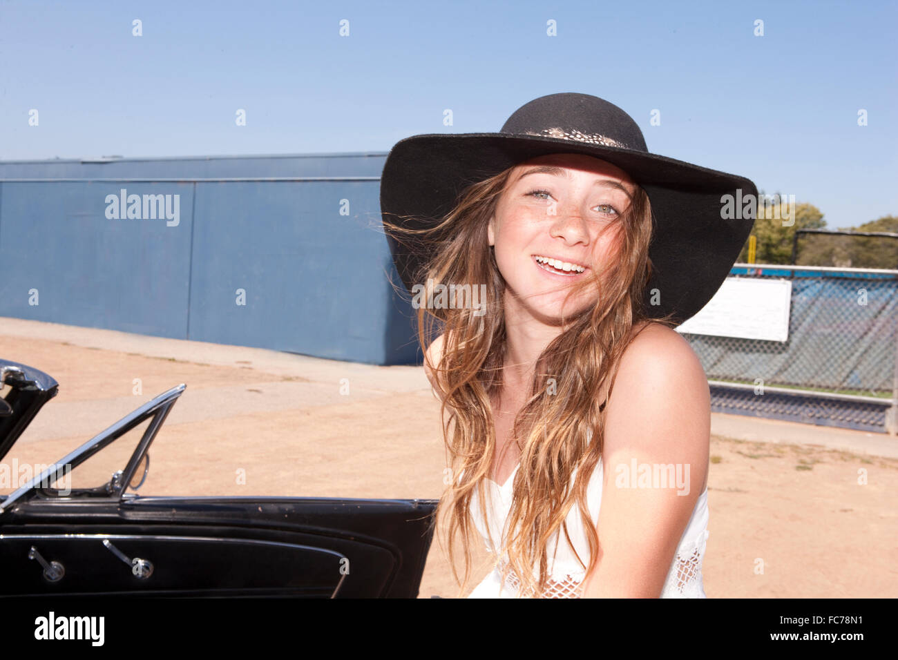 Teenage girl smiling outdoors Stock Photo