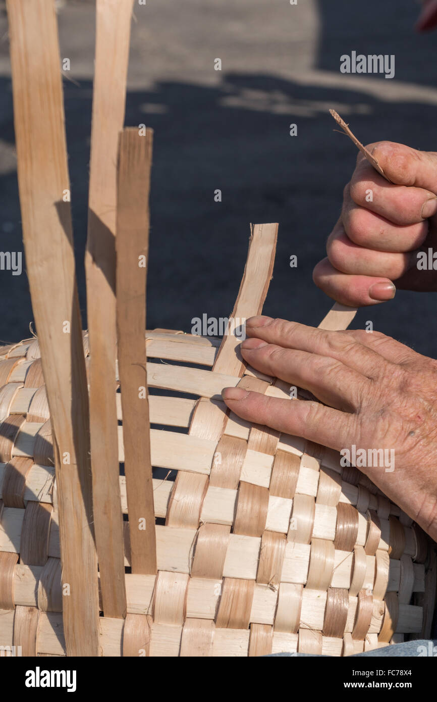 Person weaves a basket - old craftsmanship Stock Photo