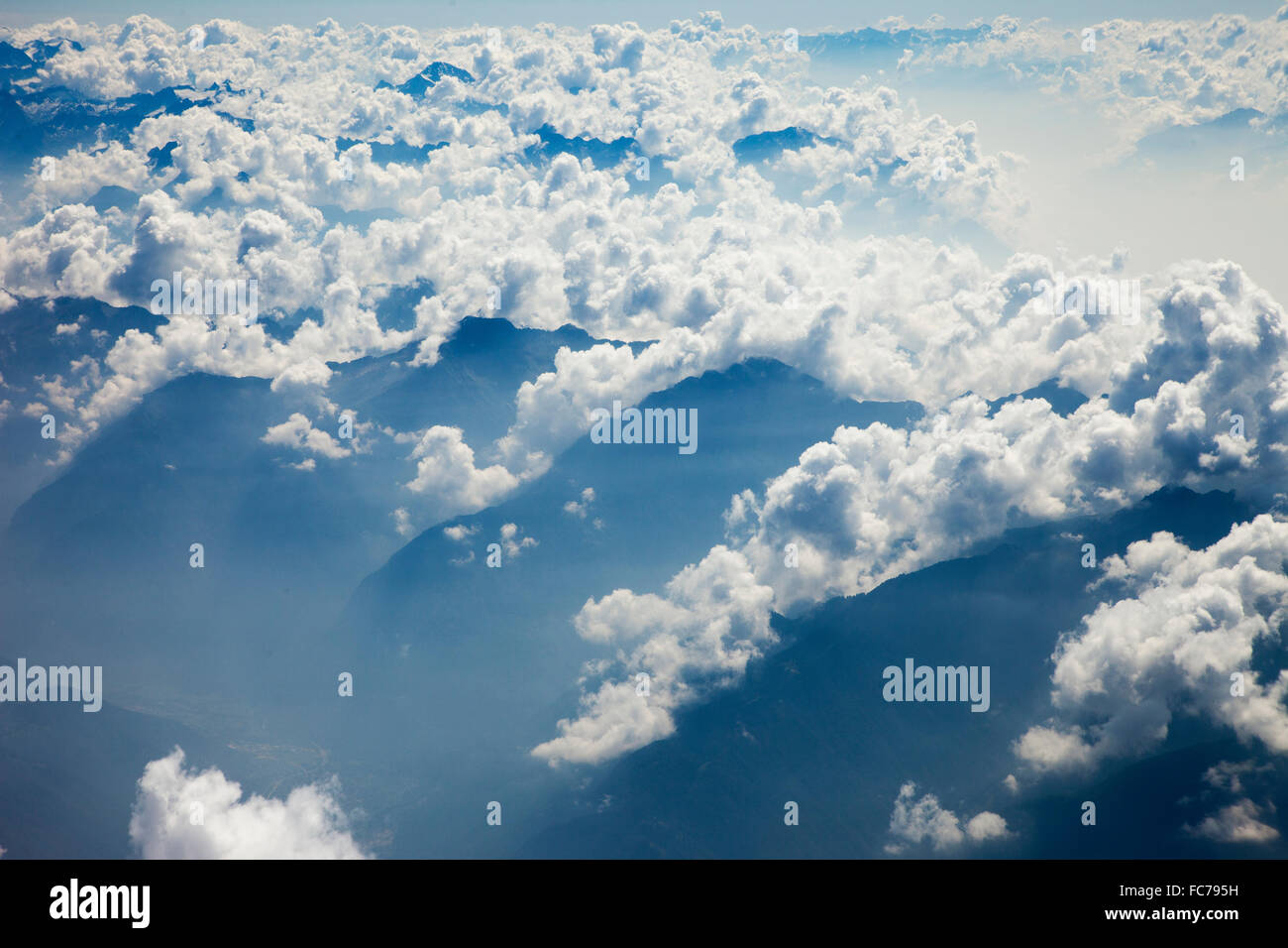 Clouds over remote mountaintops Stock Photo