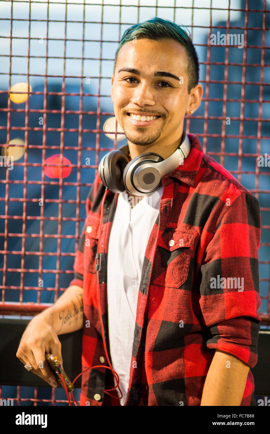 Hispanic man wearing headphones Stock Photo