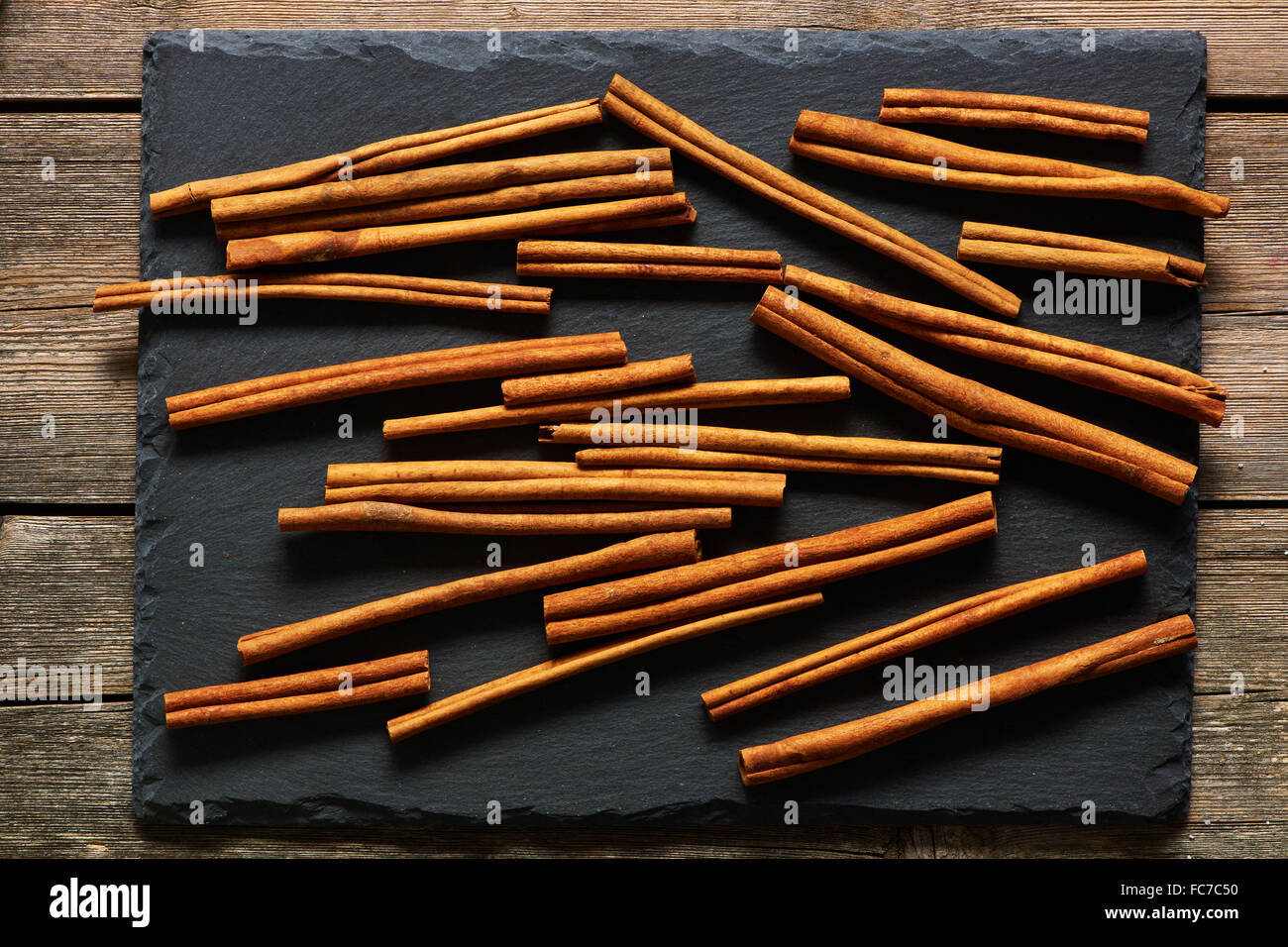 Cinnamon sticks on slate Stock Photo