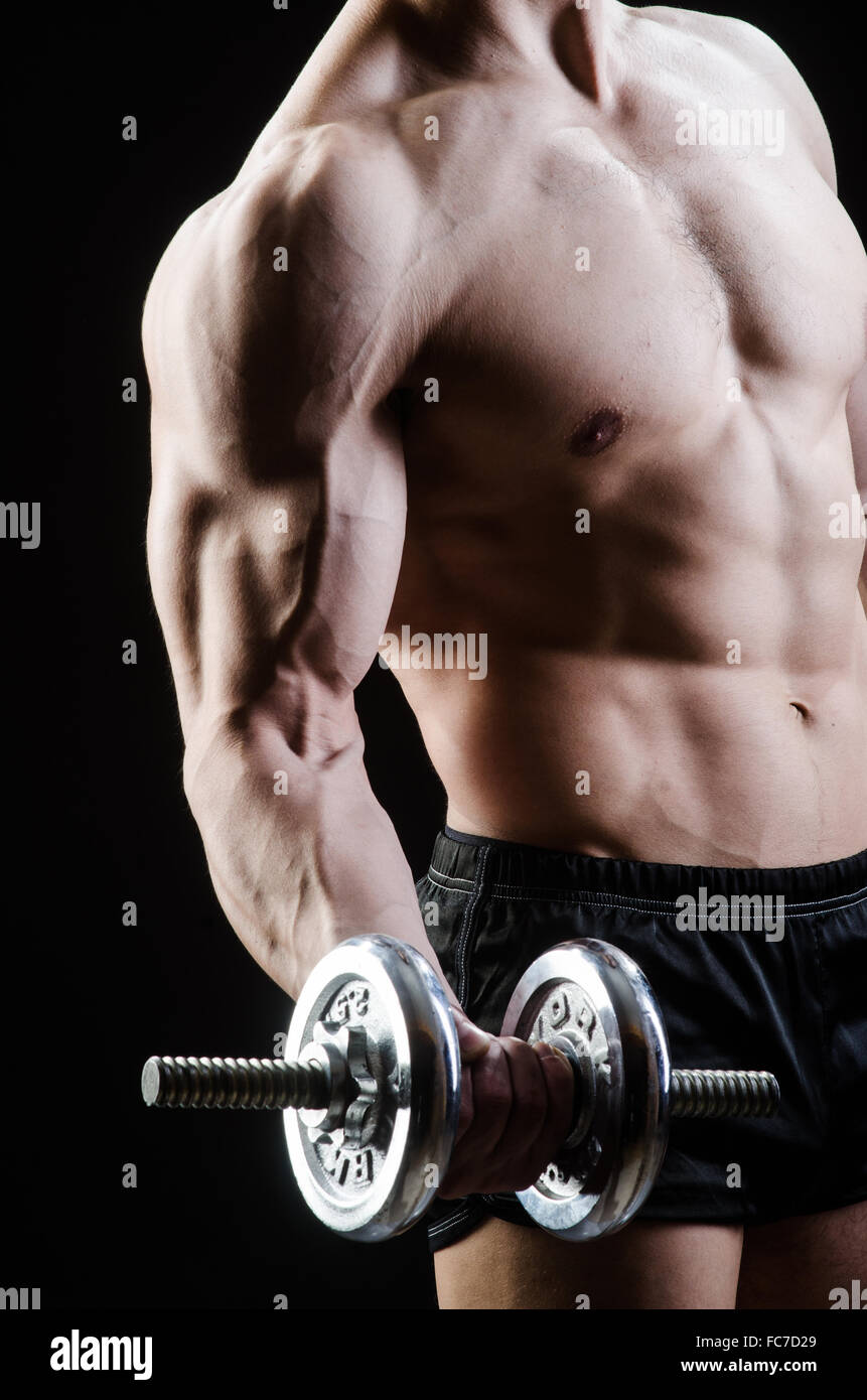 Muscular ripped bodybuilder with dumbbells Stock Photo - Alamy