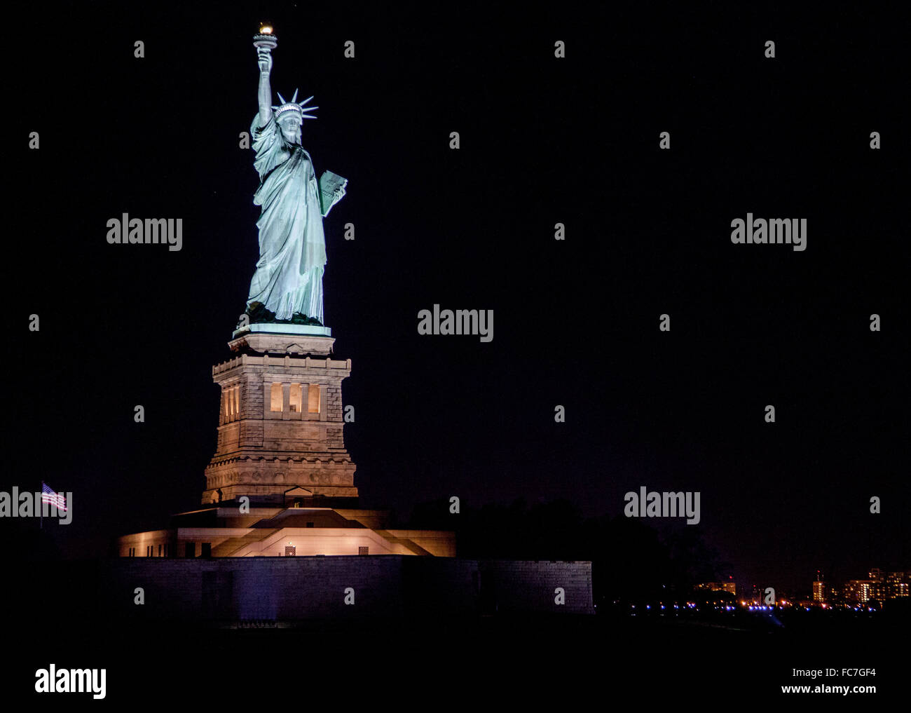 Statue of Liberty, New York USA at night seen from a boat on The Hudson River. Stock Photo