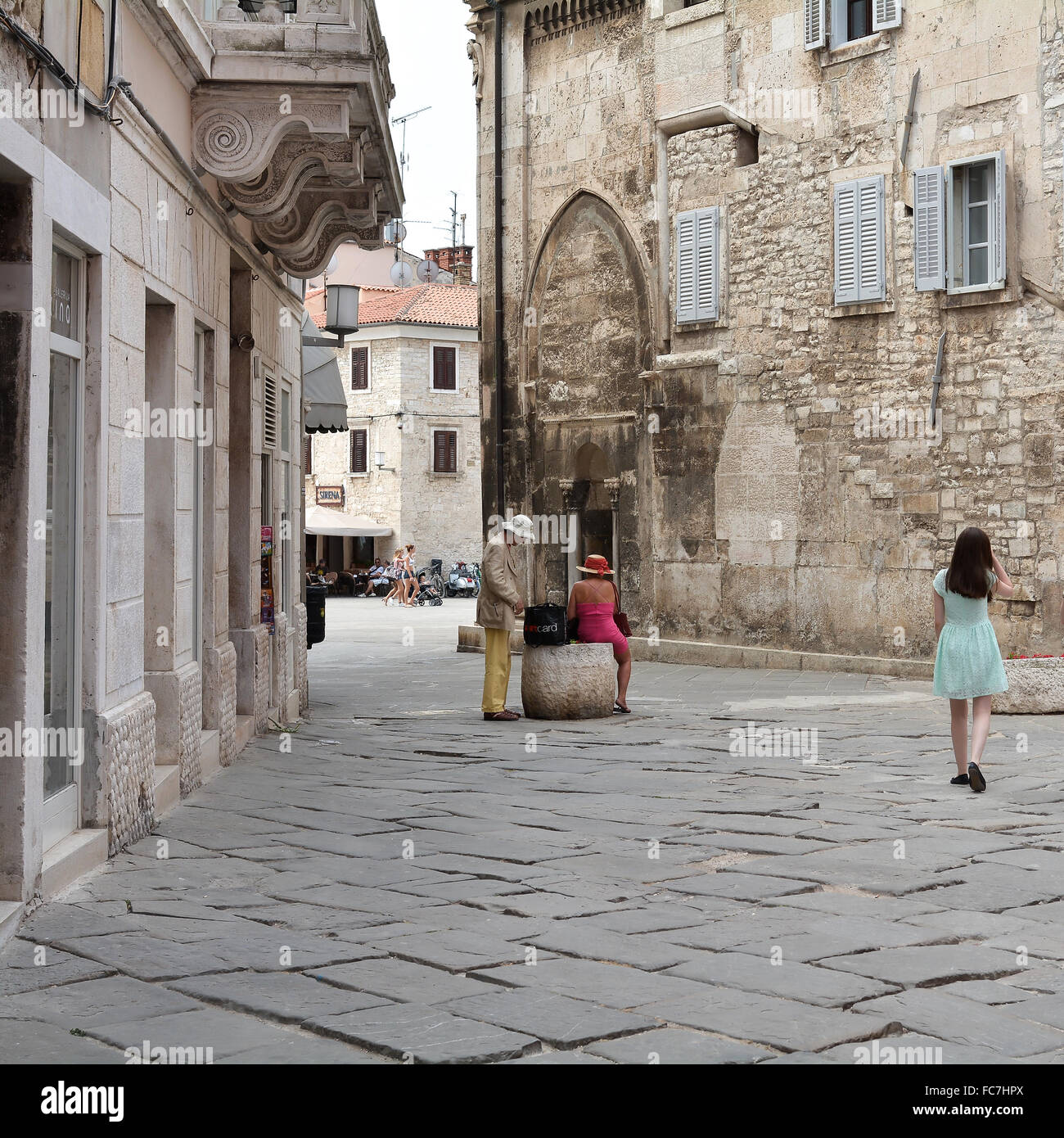 tourists in the old town of Pula Stock Photo