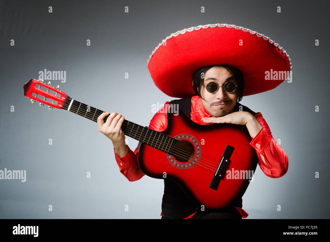 Mexican guitar player in red Stock Photo Alamy